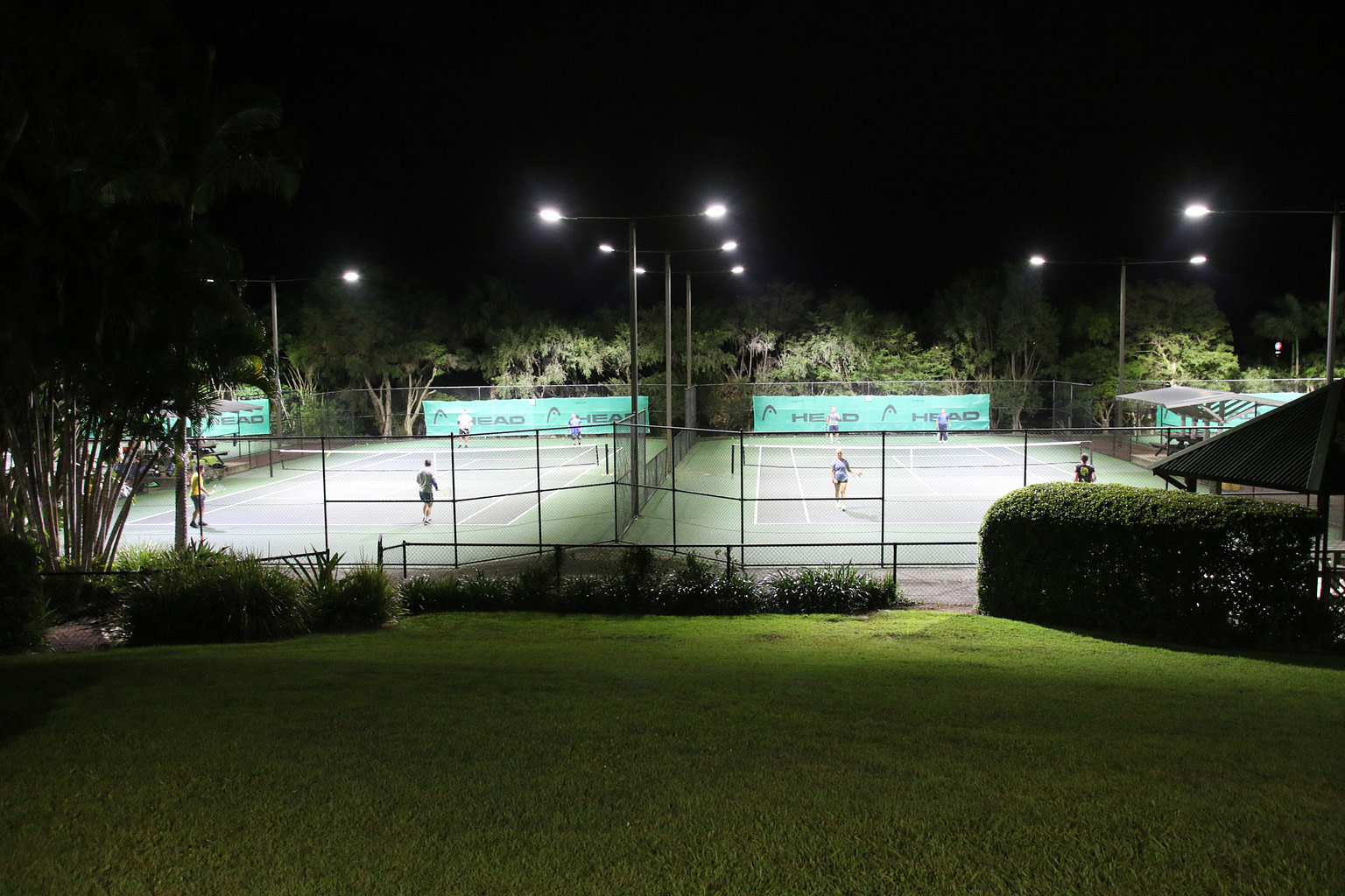 Hill top view of two courts at Club Coopers Tennis Centre using Cree Lighting OSQ (B Series)